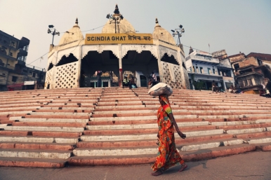A woman walks past the Scindia Ghat