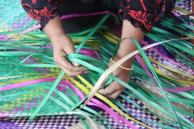 Weaving a mat using pandan or screw pine leaves