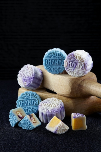 The snow skin mooncakes: Blueberry Cheese Feuillantine Blue Moon and the purple tinged-Flower Drum with soft custard egg yolk