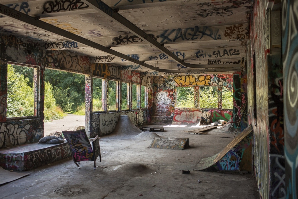 The future site is currently covered in graffiti and skate ramps