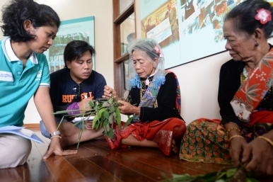 A village elder sharing her knowledge on medicinal plants