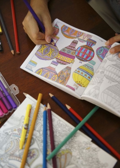 Drawings in adult colouring books are fan from childish