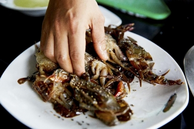 Soft shell crabs being prepped before coating in batter