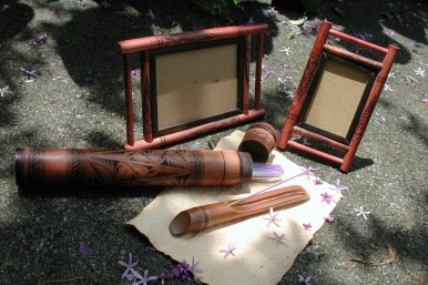Carved bamboo photoframes and incense stick containers.