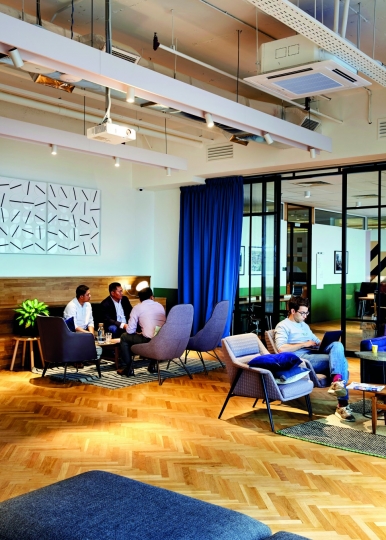 A communal workspace allows people to be as casual or as formal as they want to be