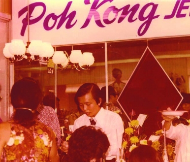 Dato Choon attending to customers in his tiny store in Camy Emporium in 1976