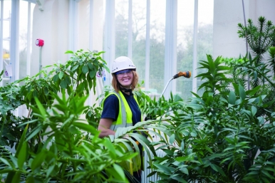 Hannah Button, Junior Horticulturist, watering the plants in the Temperate House
