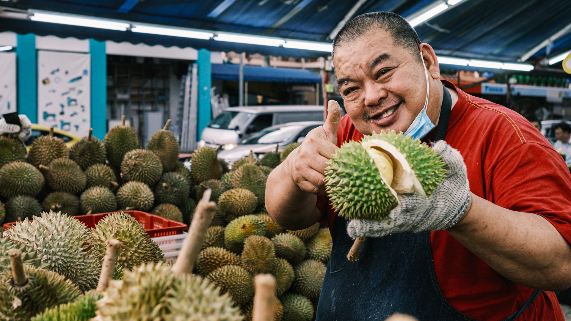 A durian seller at one of Geylang's famous fruit stalls