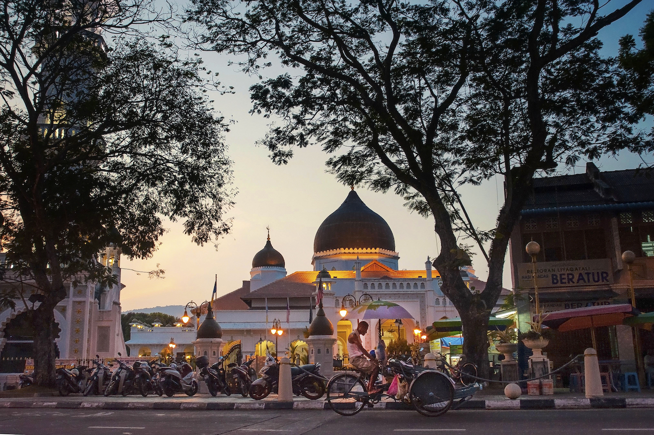 Kapitan Keling Mosque is a stone's throw from a Chinese temple, a Hindu temple and a church