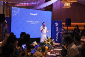 Darren Chin on stage at ''An Epicurean Journey Through Chiang Mai'' gala dinner