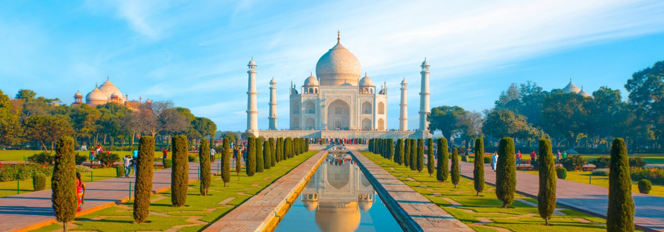 View of Taj Mahal with reflection in water at sunny day