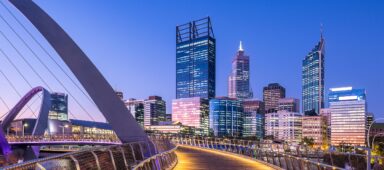 Perth CBD skyline at sunset viewed from the pedestrian bridge at Elizabeth Quay