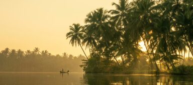 Beautiful sunrise scene of Kerala backwaters with small traditional boat